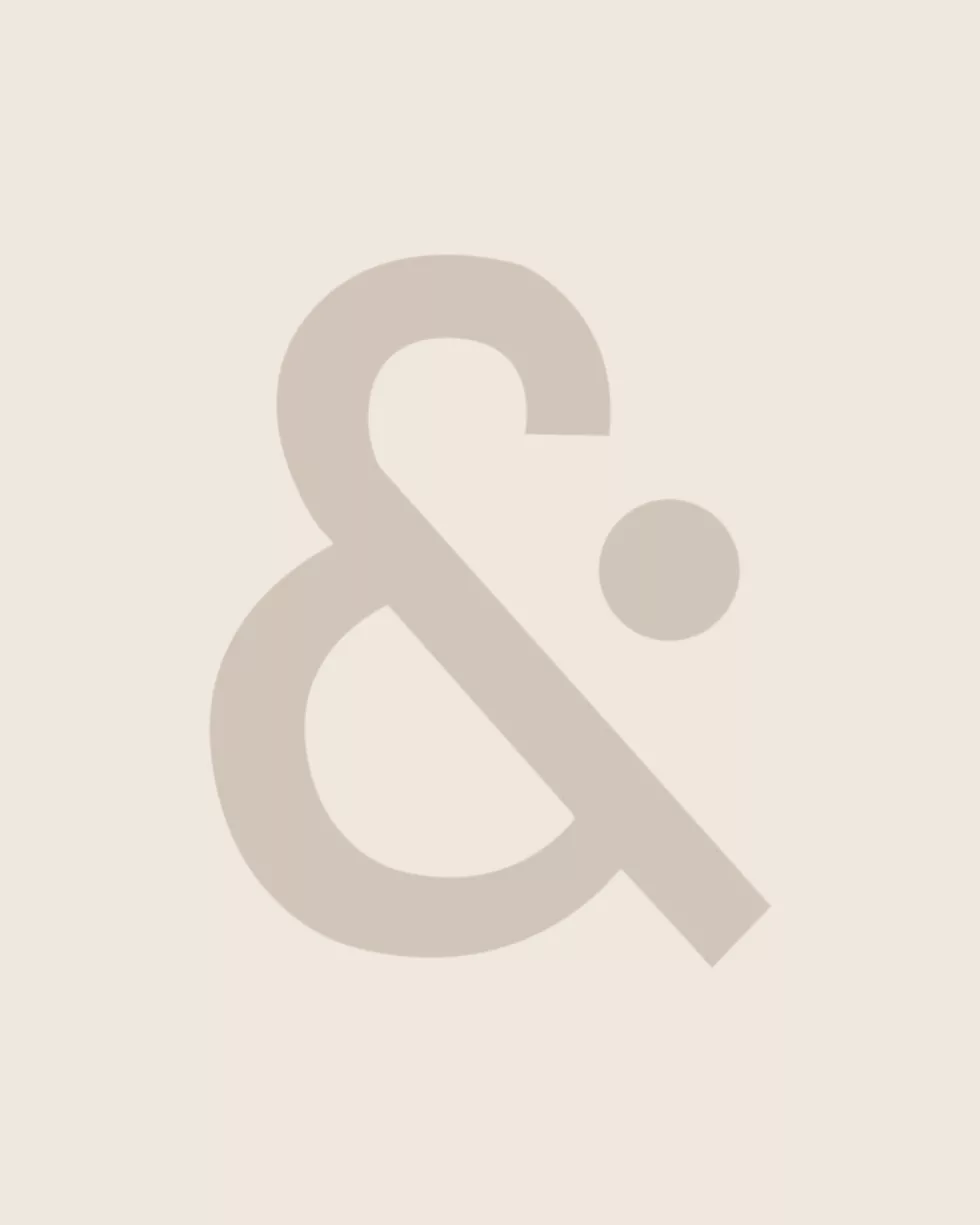 &Partners brand graphic with a large ampersand on a beige background