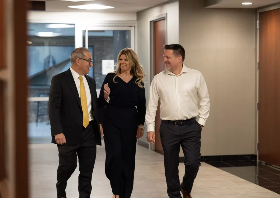 Todd Geller and the team talking in their offices in Melville, New York