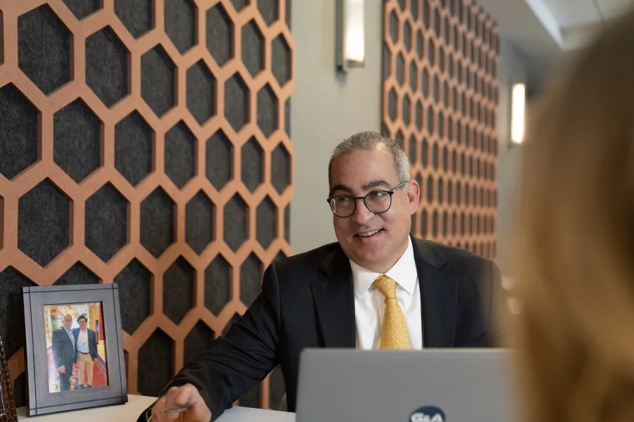 Todd Geller advising clients on a retirement plan in the Geller Private Wealth offices in Melville, New York
